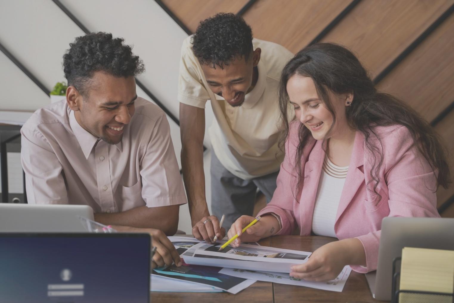 Students engaged in interactive budget planning workshop with calculators and financial documents